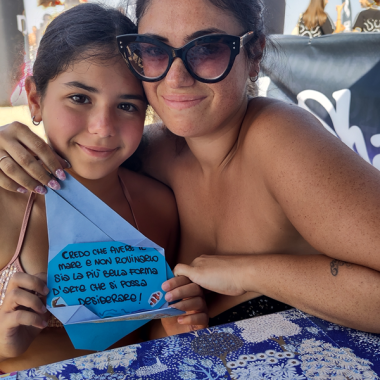 Mum and daughter in Cattolica with their Letters from the Ocean.