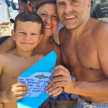 Family in Cattolica with their Letter from the Ocean.