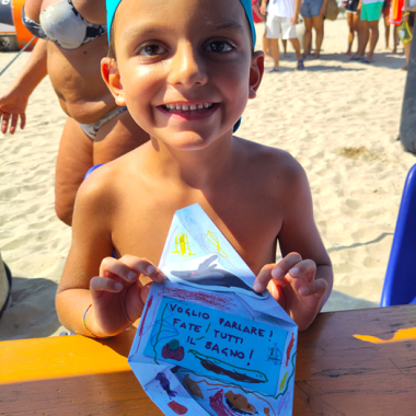 Boy in Cattolica with his Letter from the Ocean.